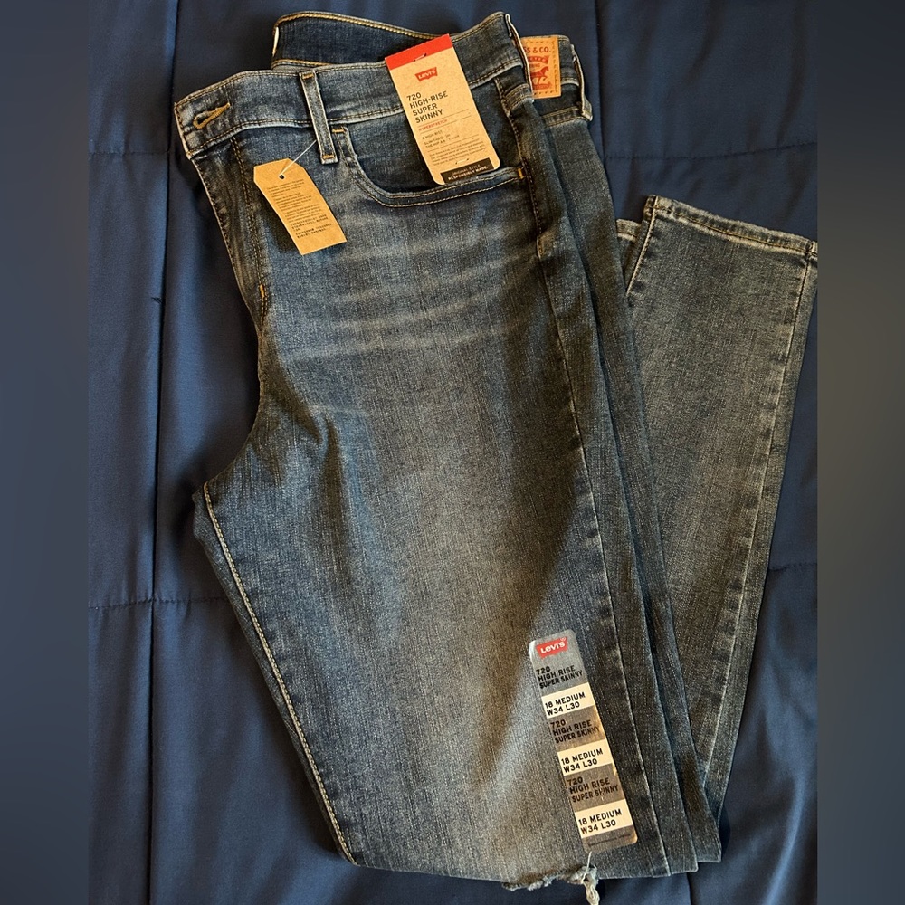 Levi 720 medium wash distressed jeans new with tags. High rise and super skinny